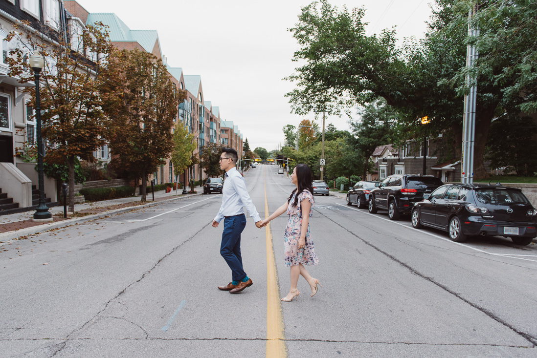 Couple crossing street | Downtown Oakville Engagement | EightyFifth Street Photography