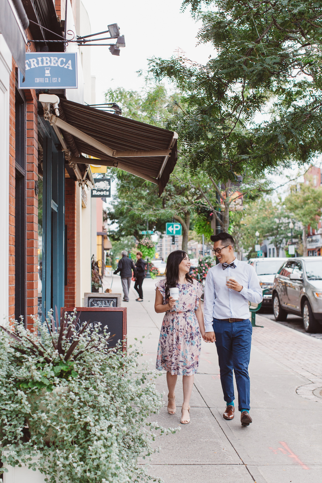 Couple walking on street | Downtown Oakville Engagement | EightyFifth Street Photography