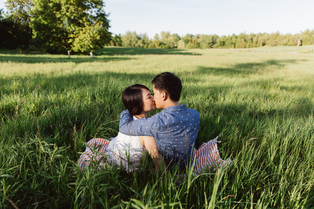 Kissing in a field of tall grass | Scotsdale Farm Engagement, Georgetown | Toronto Wedding Photographer | EightyFifth Street Photography