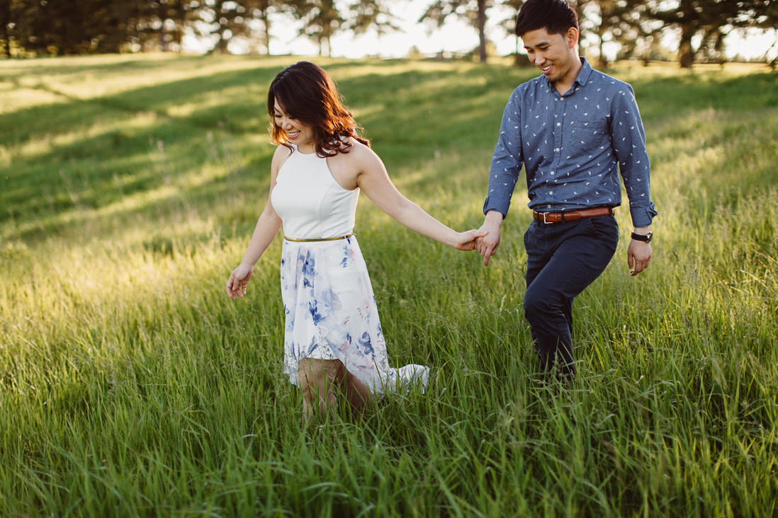 Couple walking in field of tall grass | Scotsdale Farm Engagement, Georgetown | Toronto Wedding Photographer | EightyFifth Street Photography