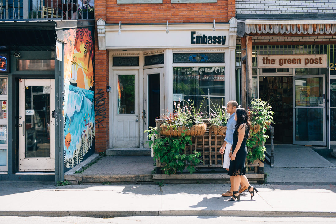 Couple walking on the sidewalk | Kensington Market Engagement, Toronto | EightyFifth Street Photography