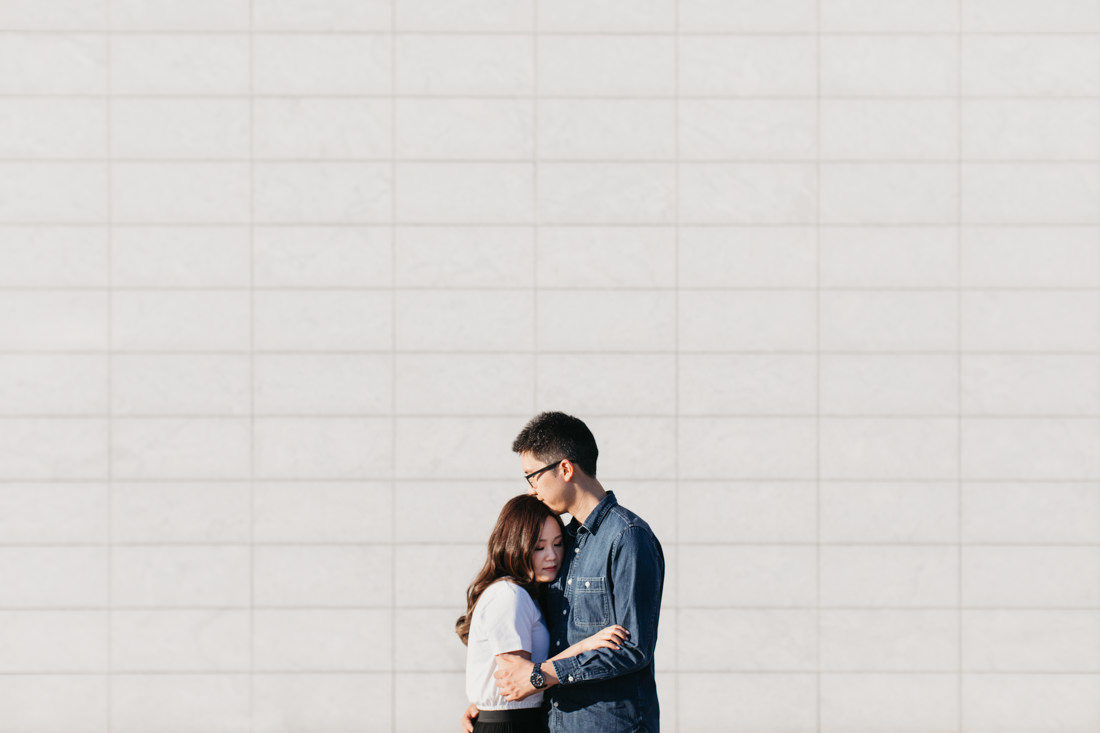 Couple hugging | Aga Khan Museum engagement | Minimalist portrait location | Toronto Wedding Photographer | EightyFifth Street Photography