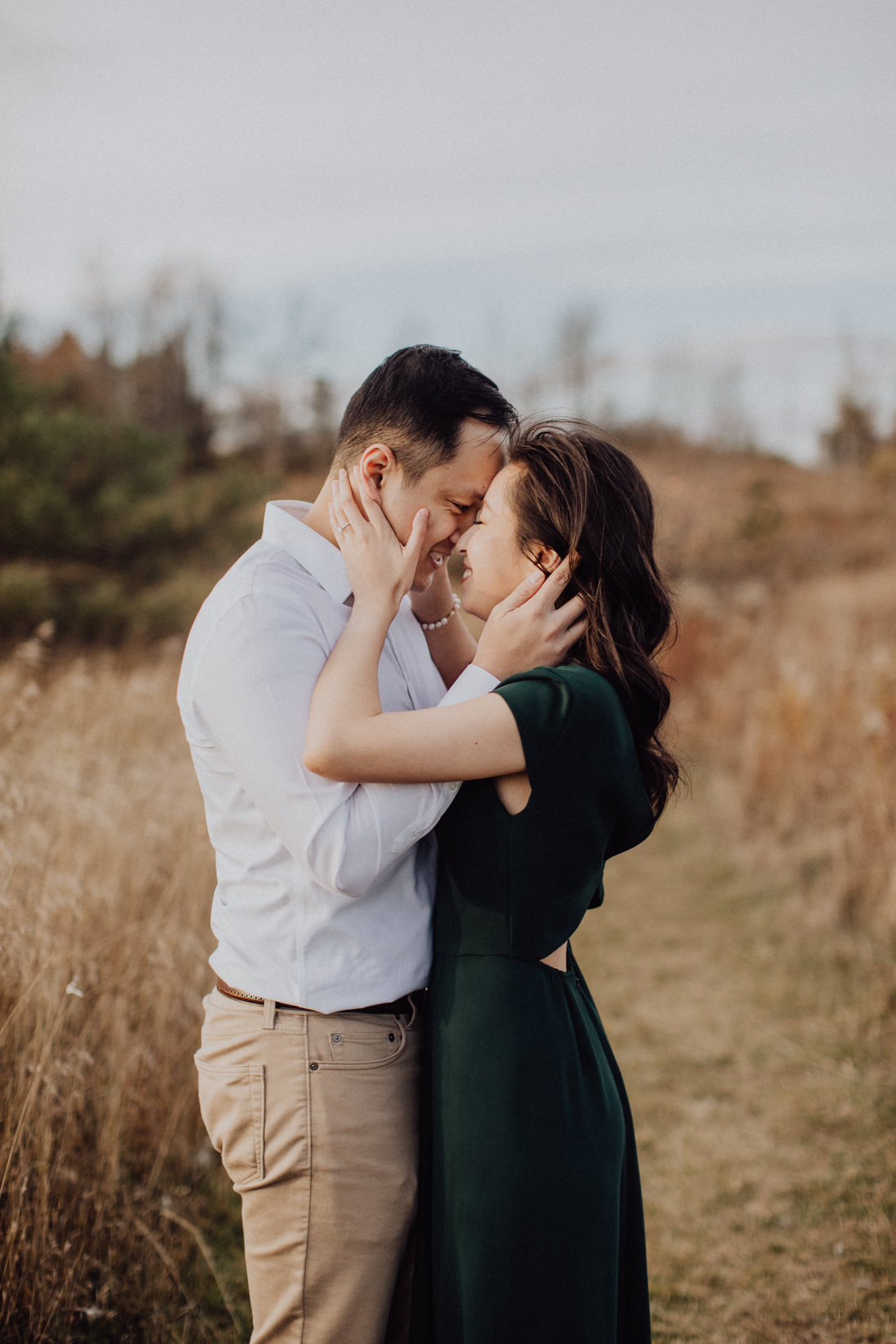 couple cupping each others face fall engagement caledon | eightyfifth street photography