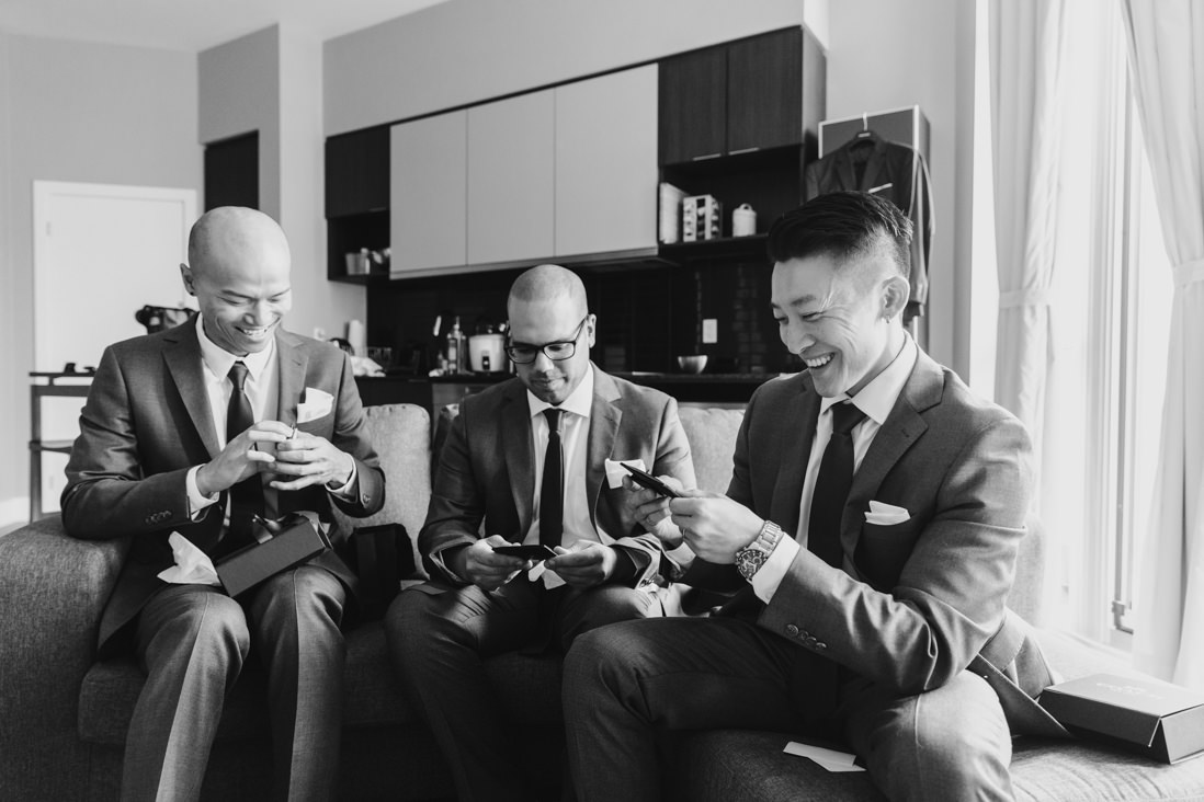 Groomsmen opening gifts Toronto_Wedding_Photographer_EightyFifth Street Photography