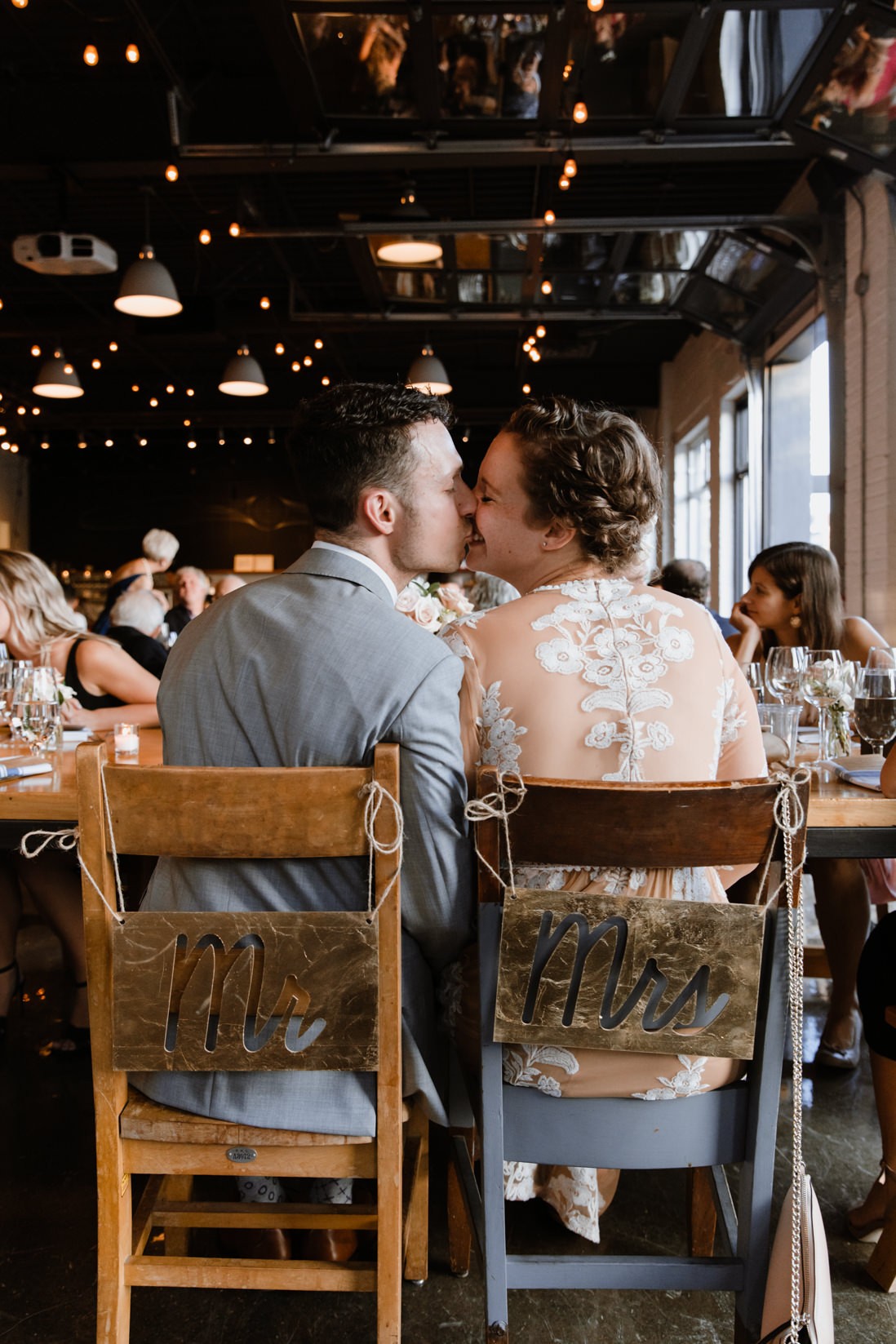 bride and groom kissing at wedding reception Propeller Coffee Co Toronto_EightyFifth Street Photography