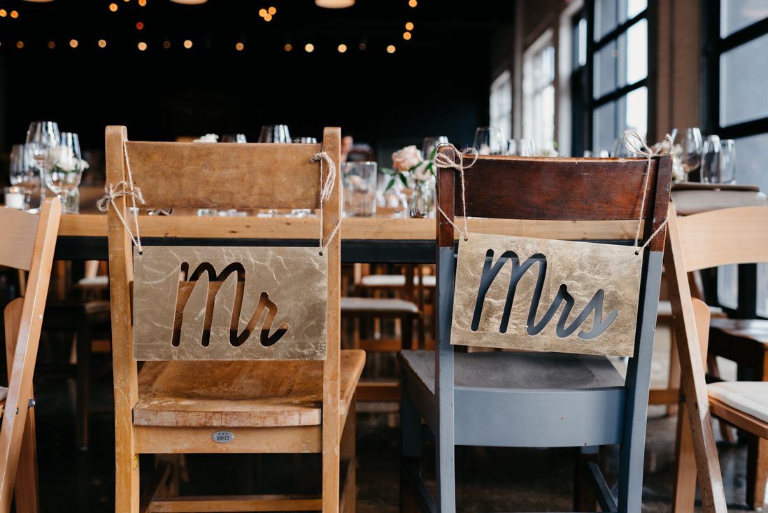 mr and mrs sign behind bride and groom's chairs Propeller Coffee Co Wedding Toronto_EightyFifth Street Photography